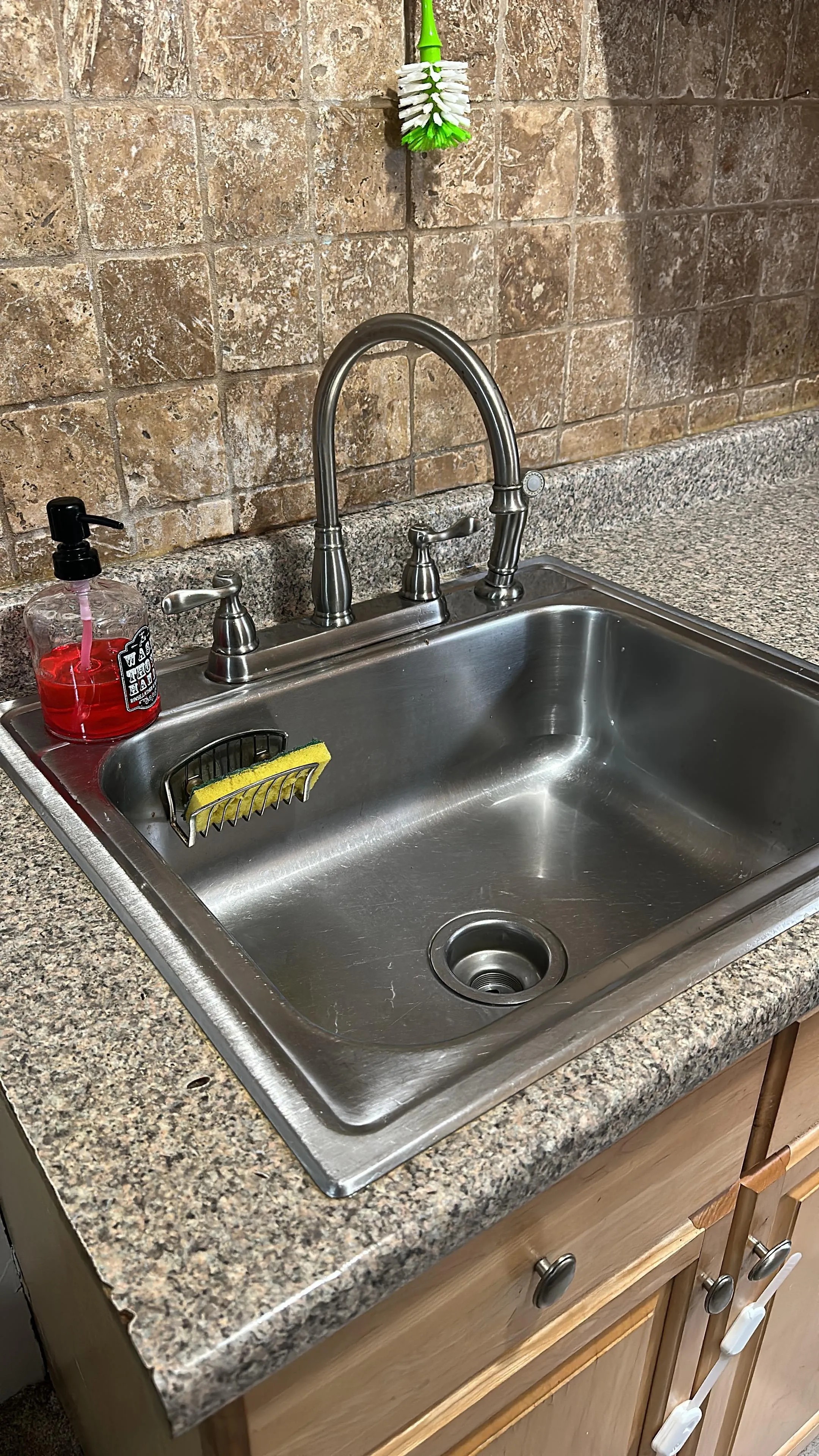 Kitchen sink after cleaning, basin and faucet shining