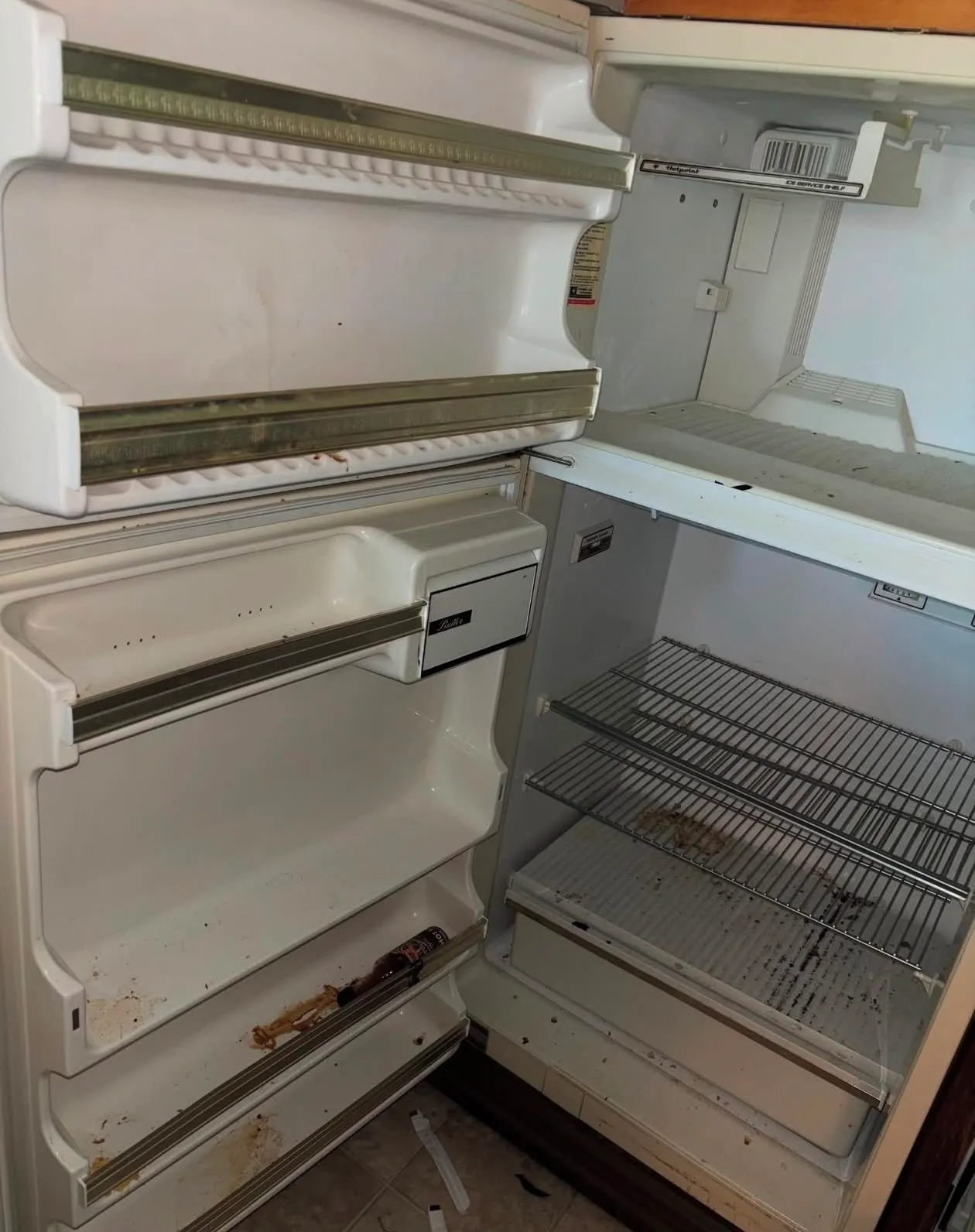 Refrigerator shelves before cleaning